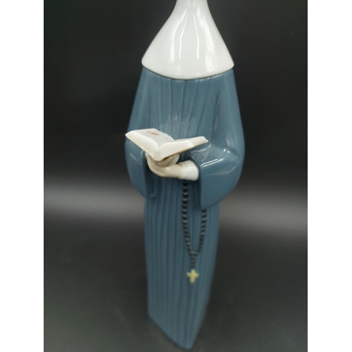 394 - A Lladro Prayerful Moment figurine model no. 5500 - approx. 27cm high