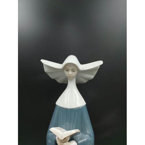 394 - A Lladro Prayerful Moment figurine model no. 5500 - approx. 27cm high