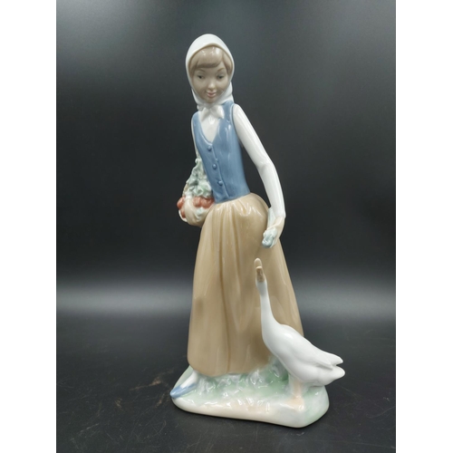 395 - Three various figurines, one Lladro Bashful Bather model no. 5455, one Nao Choir Boys ringing bell m... 