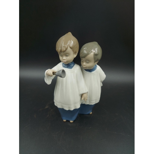 395 - Three various figurines, one Lladro Bashful Bather model no. 5455, one Nao Choir Boys ringing bell m... 