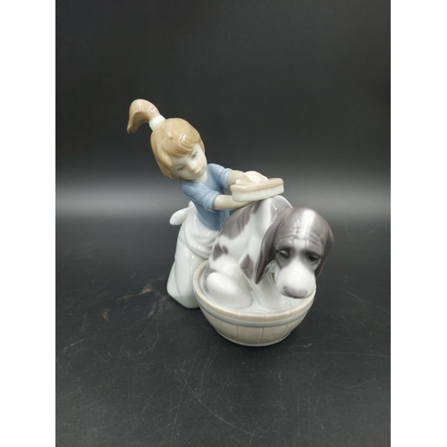 395 - Three various figurines, one Lladro Bashful Bather model no. 5455, one Nao Choir Boys ringing bell m... 