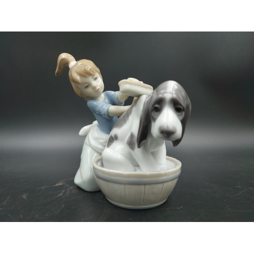 395 - Three various figurines, one Lladro Bashful Bather model no. 5455, one Nao Choir Boys ringing bell m... 