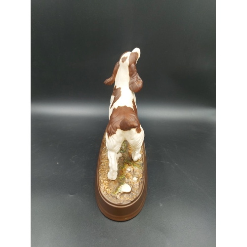 399 - A Beswick 'The Spaniel' matte porcelain figurine with stand - approx. 21cm high