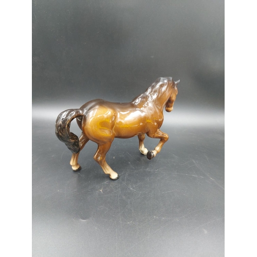 402 - Two Beswick brown horse figurines, one Stocky Jogging Mare and one Foal