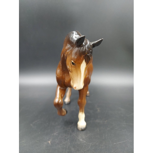 402 - Two Beswick brown horse figurines, one Stocky Jogging Mare and one Foal