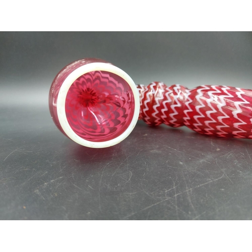 408A - A 19th century Nailsea cranberry and white swirl glass pipe - approx. 38cm long