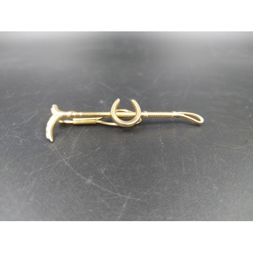 227 - A vintage Stratton Imitation horse riding crop and shoe tie clip