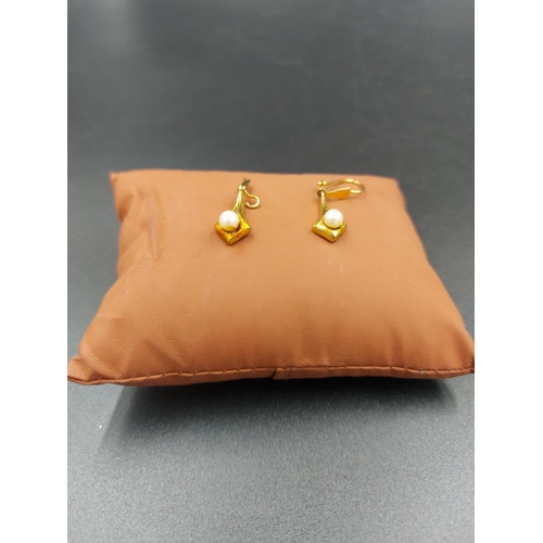 233 - A pair of hallmarked 9ct gold ladies simulated pearl earrings - approx. gross weight 1.75 grams