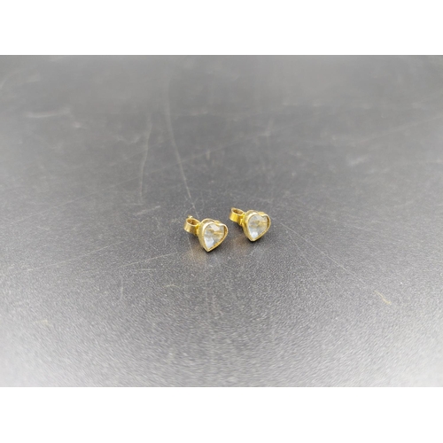 236 - A pair of stamped 9ct gold heart shaped aquamarine stud earrings - approx. gross weight 1 gram