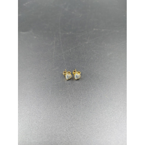 236 - A pair of stamped 9ct gold heart shaped aquamarine stud earrings - approx. gross weight 1 gram