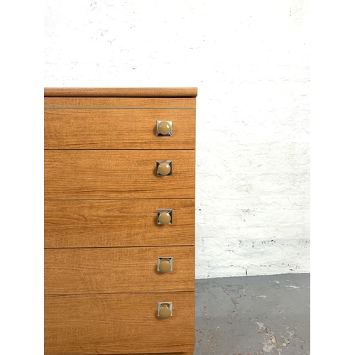 649 - A Schreiber teak effect chest of five drawers - approx. 103cm high x 80cm wide x 42cm deep