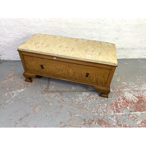 678 - An Edwardian oak wardrobe base storage bench with upholstered top - approx. 56cm high x 116cm wide x... 