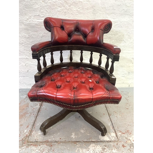 700 - A red leather Chesterfield captains swivel desk chair