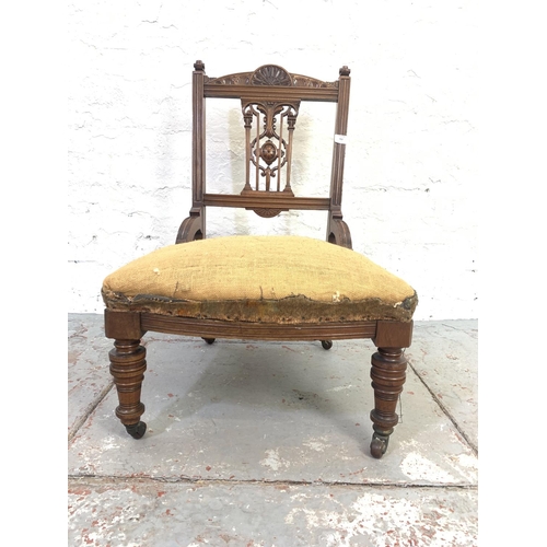 702 - A Victorian mahogany bedroom chair on ceramic castors - approx. 78cm high x 51cm wide