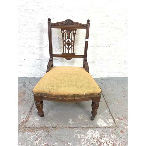 702 - A Victorian mahogany bedroom chair on ceramic castors - approx. 78cm high x 51cm wide