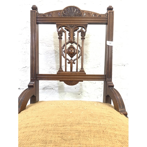 702 - A Victorian mahogany bedroom chair on ceramic castors - approx. 78cm high x 51cm wide