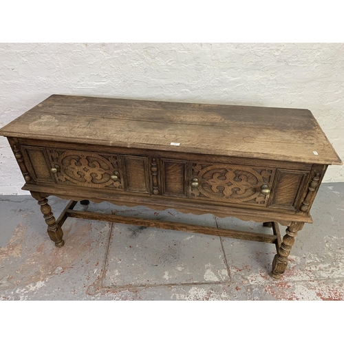 710 - A 19th century Gothic revival oak sideboard with two large drawers and one lower stretcher - approx.... 