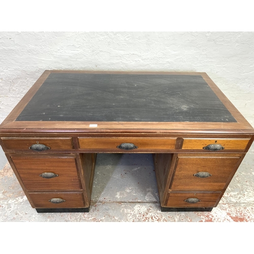 712 - A 1930s H. Baldock & Son of Liverpool mahogany pedestal desk with seven drawers and half moon handle... 