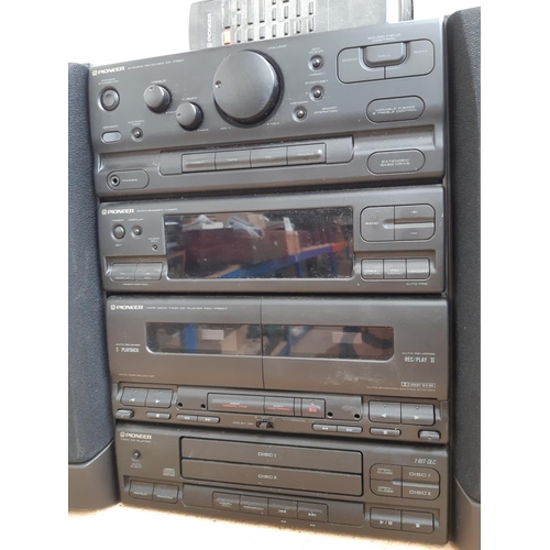 1022 - A two piece Pioneer hi-fi system comprising SX-P520 tuner, PDC-P520T twin cassette/twin CD player an... 