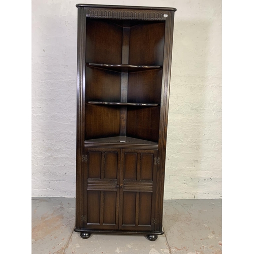 762 - An oak free standing corner cabinet with two lower doors - approx. 167cm high