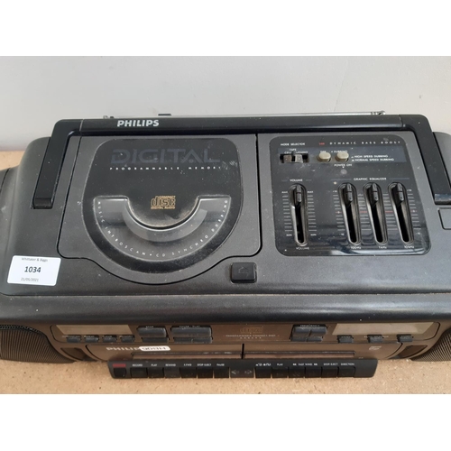 1034 - A Philips AZ8492/5 portable stereo CD player/ twin cassette/radio