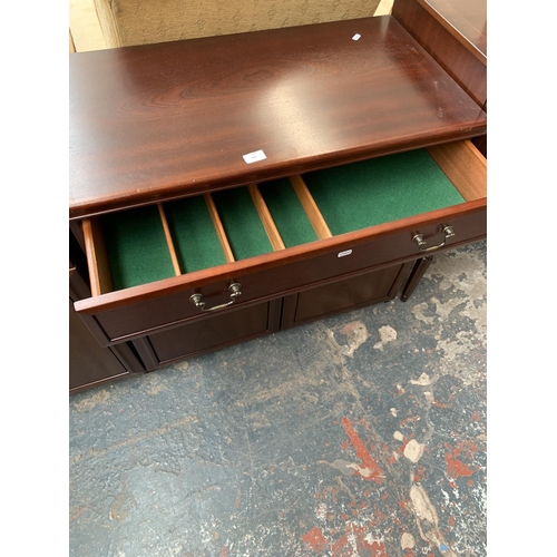 724 - A mahogany cabinet with two lower doors and one drawer - approx. 77cm high x 82.5cm wide x 44cm