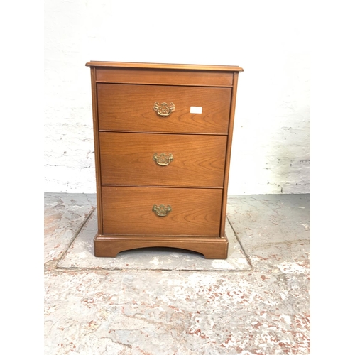 728 - A pair of Stag teak bedside chests of three drawers - approx. 72cm high x 52cm wide x 43cm deep