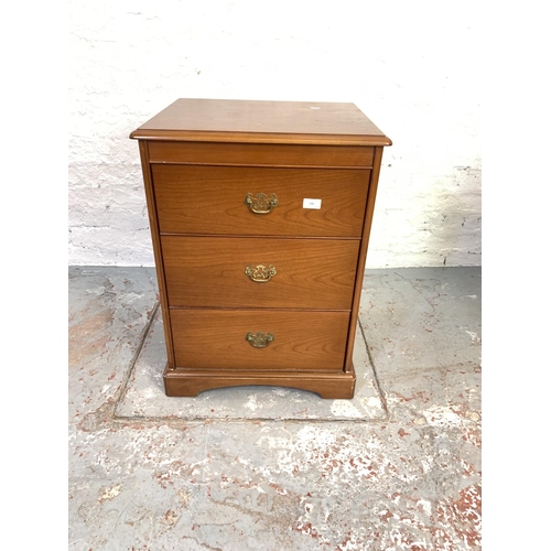 728 - A pair of Stag teak bedside chests of three drawers - approx. 72cm high x 52cm wide x 43cm deep