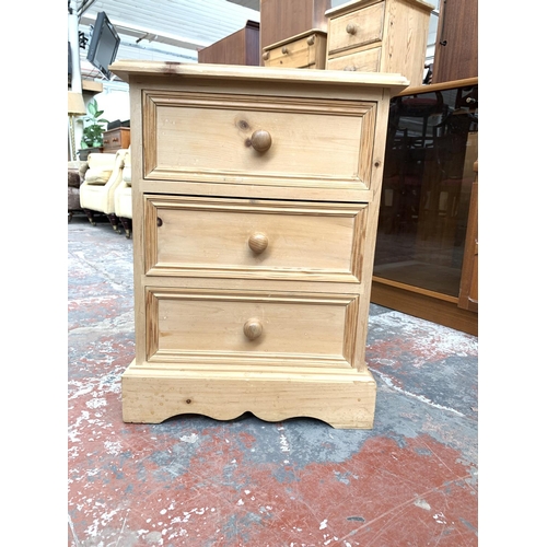 734 - A modern solid pine bedside chest of three drawers - approx. 70cm high x 46cm wide x 43cm deep