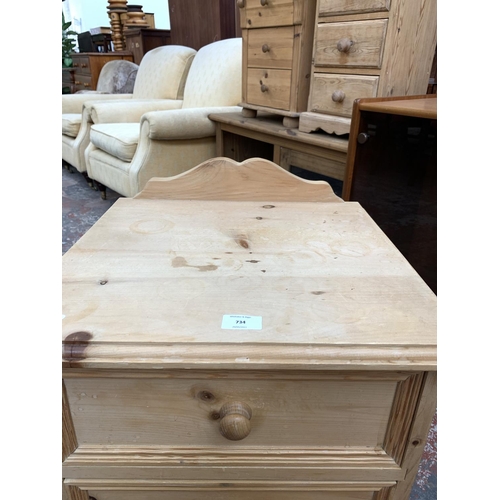 734 - A modern solid pine bedside chest of three drawers - approx. 70cm high x 46cm wide x 43cm deep