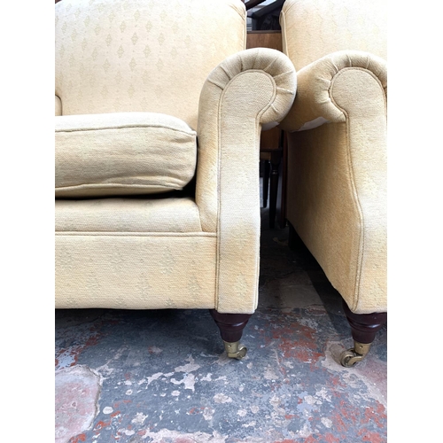 737 - Two Marks & Spencers beige upholstered arm chairs