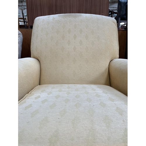 737 - Two Marks & Spencers beige upholstered arm chairs