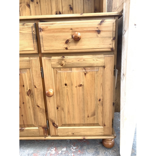 753 - A modern pine dresser with three lower doors, three drawers and two upper glazed doors - approx. 189... 