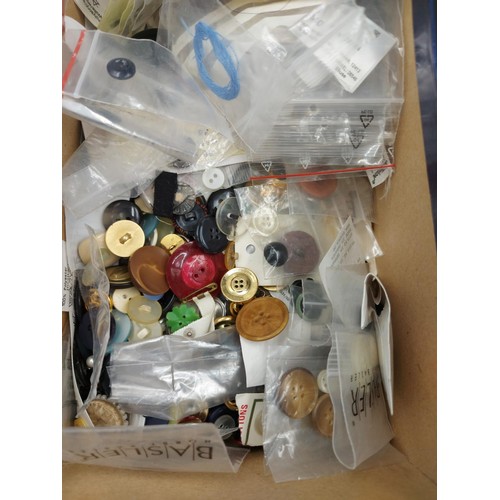 243 - A collection of assorted costume jewellery to include brooches, buttons, rings etc.