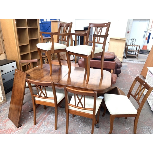 767 - A yew wood extending twin pedestal dining table and six matching chairs - approx. 76cm high x 152cm ... 