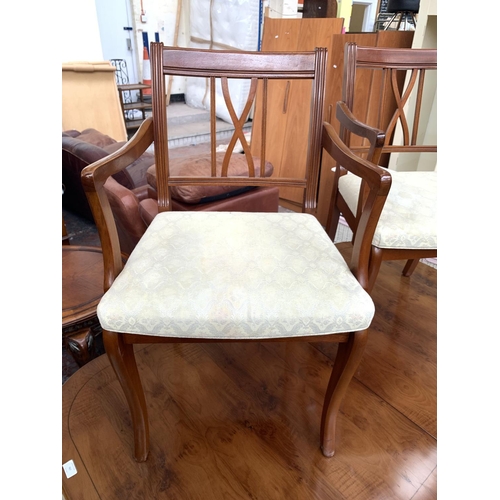 767 - A yew wood extending twin pedestal dining table and six matching chairs - approx. 76cm high x 152cm ... 