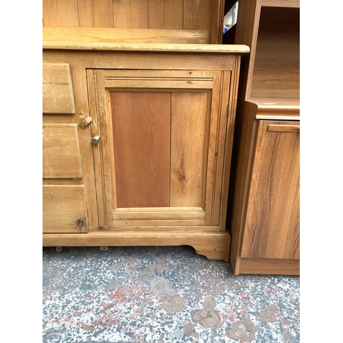 775 - A modern pine dresser with two doors, three central drawers and upper plate rate - approx. 188cm hig... 