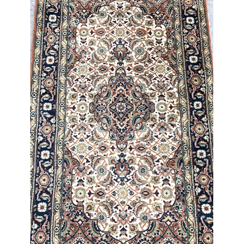 790 - An Obeetee hand knotted oriental rug - approx. 159cm x 91cm