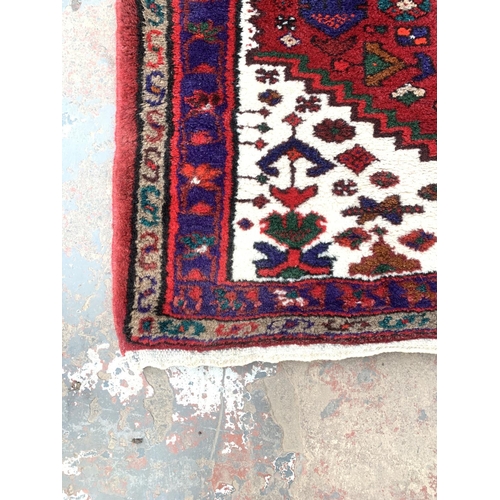 791 - A Middle Eastern style woolen rug - approx. 122cm x 78cm