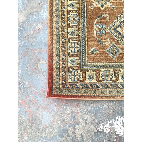 792 - An Nourison Maymana Turkish rug with classical Persian and tribal motifs - approx. 175cm x 114cm