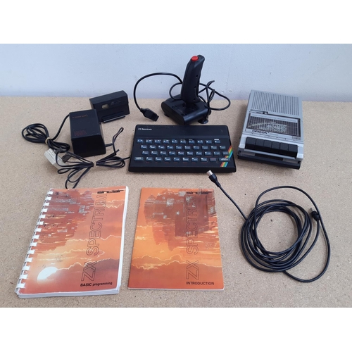 1061 - A box containing Sinclair ZX Spectrum, ZX power supply, Spectravideo™ joystick, Datel Electronics jo... 