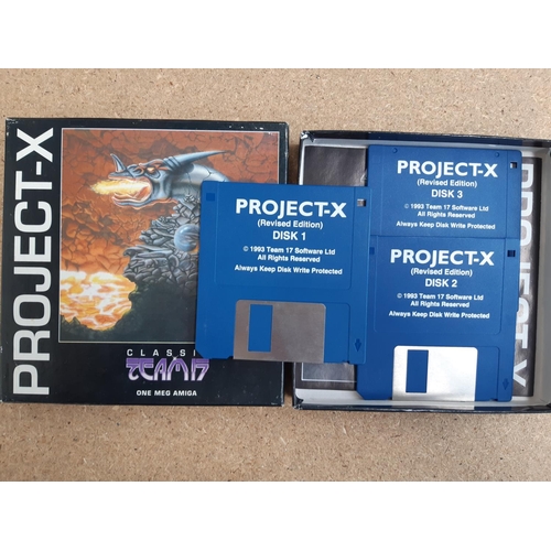 1063 - A box containing approx. twenty five boxed Commodore Amiga games to include Project X, Globdule, Ass... 