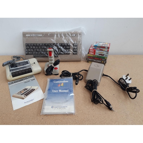 1064 - A box containing Commodore 64 with user manual, Commodore 1530 C2N Datassette with instruction manua... 