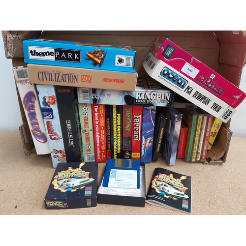 1066 - A box containing approx. twenty five boxed Commodore Amiga games to include Theme Park, Sid Meier's ... 