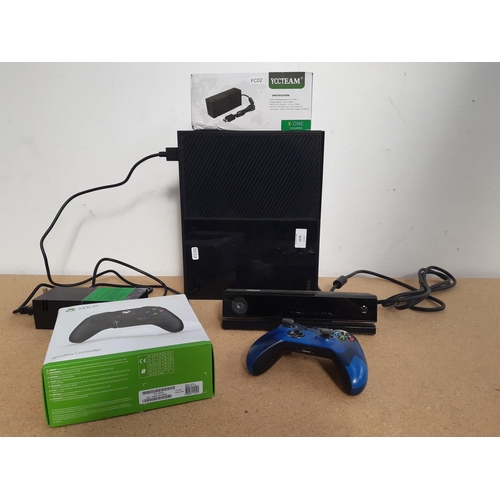 1070 - A box containing Xbox one console, two Xbox One wireless controllers (one boxed), two power supplies... 