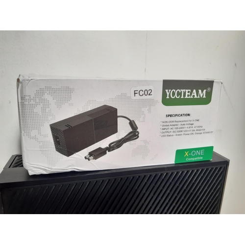 1070 - A box containing Xbox one console, two Xbox One wireless controllers (one boxed), two power supplies... 