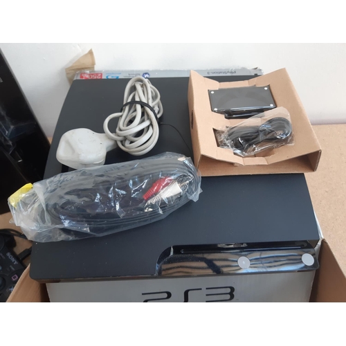 1071 - A box containing two Sony PlayStation 3 consoles, one unboxed and one boxed with leads, controller a... 