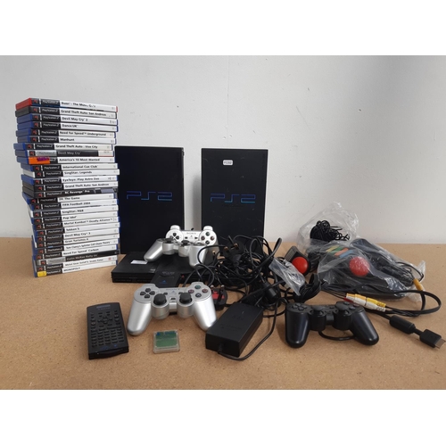 1072 - A box containing three Sony PlayStation 2 consoles, two original and one slimline with black and sil... 