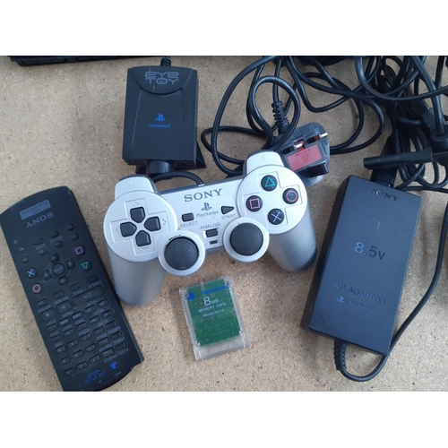 1072 - A box containing three Sony PlayStation 2 consoles, two original and one slimline with black and sil... 