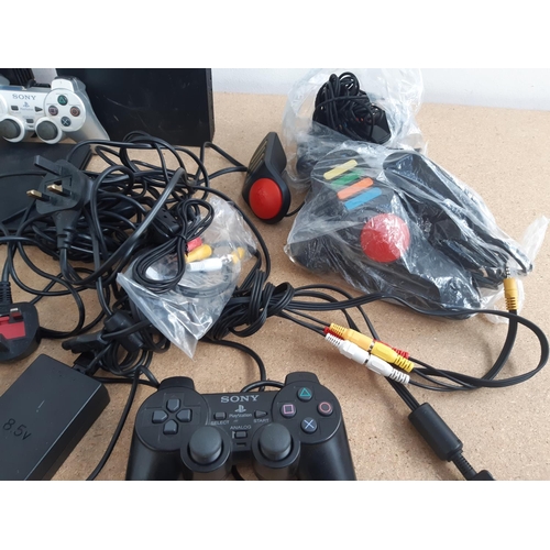 1072 - A box containing three Sony PlayStation 2 consoles, two original and one slimline with black and sil... 